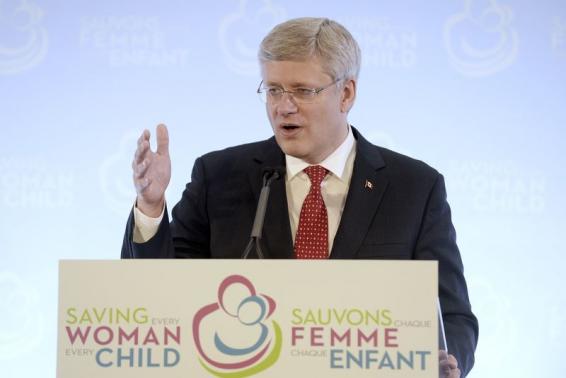 Canada's PM Harper speaks during the closing news conference for a summit in Toronto