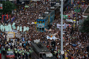 Tens of thousands of Hong Kong residents march in the annual pro-democracy