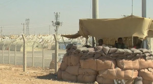 Syrian_refugee_center_with_soldiers_protecting