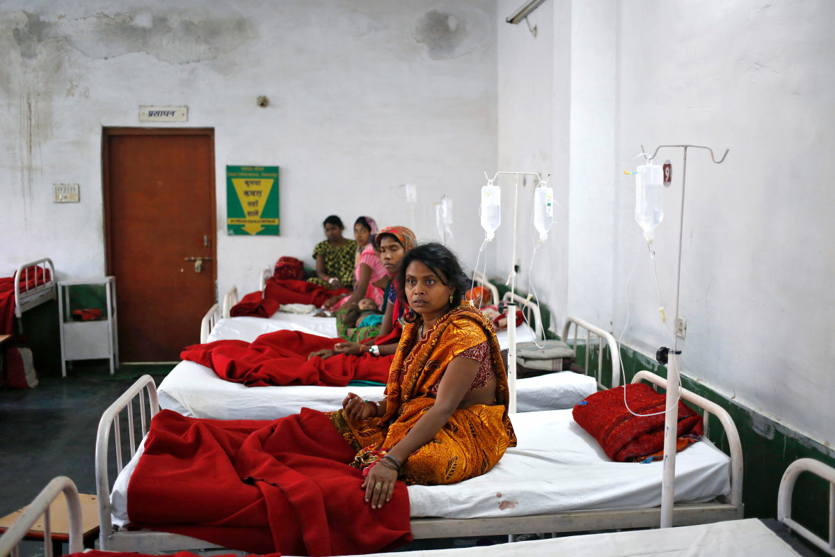 Women, who underwent a sterilization surgery at a government mass sterilisation "camp", lie in hospital beds for treatment at CIMS hospital in Bilaspur