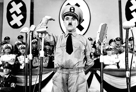 085007_1.tif. ** FILE **Legendary silent film actor/director Charlie Chaplin is shown in a scene from the 1940 film "The Great Dictator," his first film with dialogue, in this promotional photo. Chaplin plays the dual roles of a sweet-natured Jewish barber and a murderous Hitler-type dictator. Four of Chaplin's films "The Gold Rush," "The Great Dictator," "Modern Times," and "Limelight," are being released on DVD July 1, 2003, from Warner Home Video, as the first in a series of ten titles included in "The Chaplin Collection." (AP Photo/The Roy Export Company Establishment, HO)
