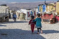 Two Syrian children walk through the Dalhamiye informal settlement for Syrian refugees in Lebanon on December 15, 2015. Photo: Corporal Mathieu Gaudreault, Canadian Forces Combat Camera IS21-2015-0041-011 ~ Deux enfants syriens se promènent dans le camp de réfugiés syriens à Dalhamiye, au Liban, le 15 décembre 2015. Photo : Caporal Mathieu Gaudreault, Caméra de combat des Forces canadiennes, MDN IS21-2015-0041-011